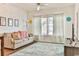 Bright living room with comfy couch and large windows at 1302 River Oaks Dr. # 4-F, Myrtle Beach, SC 29579