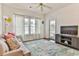 Living room with access to balcony, neutral colors at 1302 River Oaks Dr. # 4-F, Myrtle Beach, SC 29579