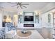 Living area with built-in shelving, fireplace, and large TV at 1305 Seabrook Plantation Way, North Myrtle Beach, SC 29582