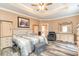 Main bedroom with dresser, large bed and seating area at 136 Glenmoor Dr., Conway, SC 29526