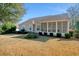 House backyard with screened-in porch and manicured lawn at 1405 Surf Pointe Dr., North Myrtle Beach, SC 29582