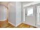 Light and airy entryway with light blue walls, hardwood floors, and white trim at 1405 Surf Pointe Dr., North Myrtle Beach, SC 29582