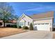 Tan house with white garage door and stone accents at 1405 Surf Pointe Dr., North Myrtle Beach, SC 29582