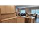 Kitchen with white cabinets, quartz countertops, and stainless steel dishwasher at 1407 Gooseneck Place # 101, Murrells Inlet, SC 29576