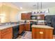 Updated kitchen featuring wood cabinets and black appliances at 1594 Palmina Loop # B, Myrtle Beach, SC 29588