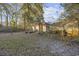 Large backyard with trees and a partly visible home at 1647 Running Water Dr., Murrells Inlet, SC 29576