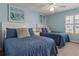 Two twin beds, nightstand, and coastal decor at 1820 N Ocean Blvd. # 305E, North Myrtle Beach, SC 29582