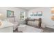 Bedroom featuring a crib, comfortable chair, and soft lighting for a cozy environment at 201 Ashworth Dr., Tabor City, NC 28463