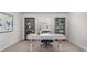 Office space featuring a modern desk, shelves, and a chair for an inspiring workspace at 201 Ashworth Dr., Tabor City, NC 28463