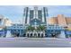 Paradise Resort's exterior boasts a modern, blue-toned design with palm trees and ample parking at 2201 S Ocean Blvd. # 1504, Myrtle Beach, SC 29577