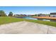 Concrete patio overlooking a pond and neighborhood homes at 2209 Beauclair Ct., Myrtle Beach, SC 29579
