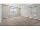Spacious bedroom with carpet, neutral walls and two windows at 2209 Beauclair Ct., Myrtle Beach, SC 29579