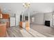 Kitchen with wood cabinets, island, and views into the living room at 2209 Beauclair Ct., Myrtle Beach, SC 29579