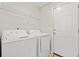 Laundry room with washer, dryer, and shelving at 2209 Beauclair Ct., Myrtle Beach, SC 29579