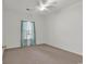 Bedroom featuring a ceiling fan, plush carpet, and large window with natural light at 242 Sun Colony Blvd. # 303, Longs, SC 29568