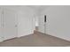 Bedroom with plush carpet, closet, and a door to another room at 242 Sun Colony Blvd. # 303, Longs, SC 29568