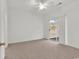 Bedroom featuring a ceiling fan and a sliding glass door to the outside patio at 242 Sun Colony Blvd. # 303, Longs, SC 29568