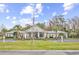 Exterior shot of the community clubhouse with an American flag at 242 Sun Colony Blvd. # 303, Longs, SC 29568