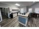 Cozy kitchenette with white cabinetry and a granite countertop, perfect for gatherings and snacking at 242 Sun Colony Blvd. # 303, Longs, SC 29568