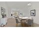 Inviting living space with a dining area and sliding glass doors leading to a balcony at 242 Sun Colony Blvd. # 303, Longs, SC 29568