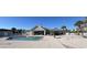 Community pool and clubhouse with tennis nets in background at 242 Sun Colony Blvd. # 303, Longs, SC 29568