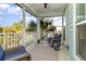 Relaxing screened porch with wicker furniture and string lights at 301 Splendor Circle, Murrells Inlet, SC 29576