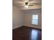 Spacious bedroom with hardwood floors and ceiling fan at 326 East Godbold St., Marion, SC 29571
