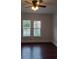 Bright bedroom with hardwood floors and ceiling fan at 326 East Godbold St., Marion, SC 29571