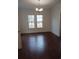 Bright dining room features hardwood floors and a chandelier at 326 East Godbold St., Marion, SC 29571