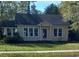 Charming yellow house with a well-maintained lawn and gray roof at 326 East Godbold St., Marion, SC 29571