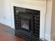 Gas fireplace with black tile surround and white mantel at 326 East Godbold St., Marion, SC 29571