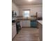 Modern kitchen with granite countertops and stainless steel appliances at 326 East Godbold St., Marion, SC 29571