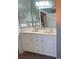 Bathroom featuring a double vanity sink with white cabinets and a large mirror at 389 Cabo Loop, Myrtle Beach, SC 29588