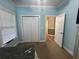 Cozy bedroom with a bi-fold closet and views into the home's other rooms at 389 Cabo Loop, Myrtle Beach, SC 29588