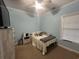 Bright bedroom featuring light blue paint, a window, and a soft comfortable bed at 389 Cabo Loop, Myrtle Beach, SC 29588