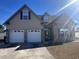 Charming home with a two-car garage, brick accents, and well-maintained landscaping at 389 Cabo Loop, Myrtle Beach, SC 29588