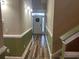 Inviting hallway with wood flooring, leading to a white front door with a decorative wreath at 389 Cabo Loop, Myrtle Beach, SC 29588
