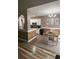 Bright kitchen and dining area with white cabinetry, stainless steel appliances, and stylish decorative accents at 389 Cabo Loop, Myrtle Beach, SC 29588
