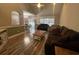 Bright living room with hardwood floors, comfortable seating, and an open view to the dining area at 389 Cabo Loop, Myrtle Beach, SC 29588