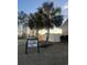 Neighborhood street view with tropical palm trees, green lawns, and charming street signs at 389 Cabo Loop, Myrtle Beach, SC 29588