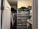 Organized walk-in closet equipped with wire shelving and transparent storage bins at 389 Cabo Loop, Myrtle Beach, SC 29588