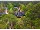 Aerial view of a lovely home nestled among lush trees, showcasing its beautiful surroundings and landscaping at 40 Capt Anthony White Ln., Georgetown, SC 29440