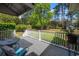 Relaxing back deck with a table and chairs overlooking a lush backyard at 40 Capt Anthony White Ln., Georgetown, SC 29440