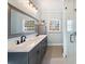 Modern bathroom featuring double vanity, elegant fixtures, and glass shower at 40 Capt Anthony White Ln., Georgetown, SC 29440