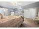 Bright bedroom with a full bed, chair, desk, closet, and dresser at 40 Capt Anthony White Ln., Georgetown, SC 29440