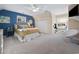 Bright bedroom with plush carpet, a blue accent wall, a window view, and a ceiling fan at 40 Capt Anthony White Ln., Georgetown, SC 29440