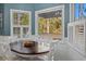 Charming breakfast nook with wood table, white chairs, and natural light at 40 Capt Anthony White Ln., Georgetown, SC 29440