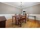 Spacious dining area features hardwood floors, chandelier and bench style seating at 40 Capt Anthony White Ln., Georgetown, SC 29440