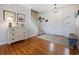 Bright entryway with hardwood floors, shiplap wall, and staircase at 40 Capt Anthony White Ln., Georgetown, SC 29440