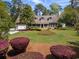 Charming home featuring a well-manicured front yard and a welcoming front porch at 40 Capt Anthony White Ln., Georgetown, SC 29440